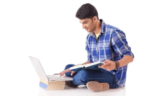 Young Man Using Laptop Foto stock