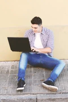 Young man using laptop Stock Photos