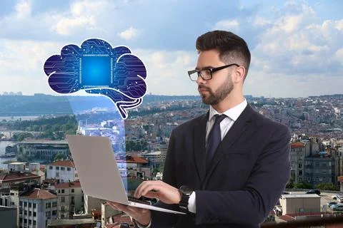 Young man using laptop with virtual image of brain and cityscape on backgroun Foto stock