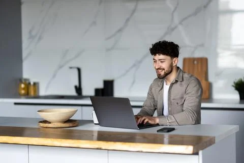 Young man using laptop writing email or message, chatting, working online, .. 스톡 사진