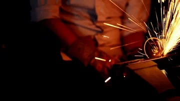 Young Man using a metal grinder. Stock Footage 85676264