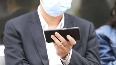 Young man using mobile phone in subway Stock Footage 168273729