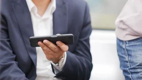 Young man using mobile phone in subway Stock Footage 168273732