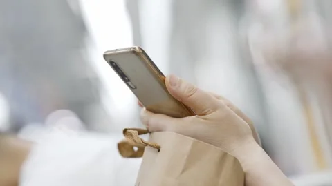 Young man using mobile phone in subway Stock Footage 195080752