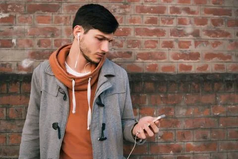 Young man using mobile phone. Stock Photos