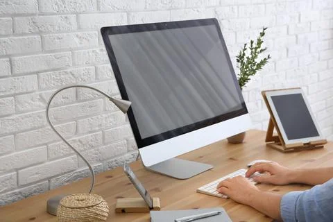 Young man using modern computer at table, closeup 스톡 사진
