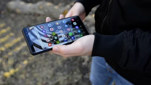 Young man using modern smartphone Stock Footage 104506045