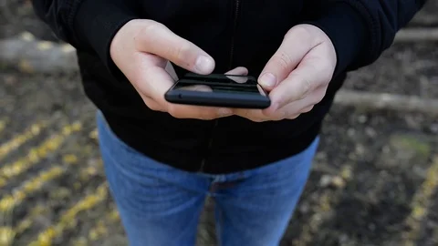 Young man using modern smartphone Stock Footage 104506092