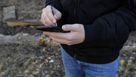 Young man using modern smartphone Stock Footage 104506197