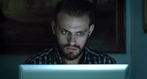 Young man using notebook computer during the night: social networks on-line Stock Footage 42986219