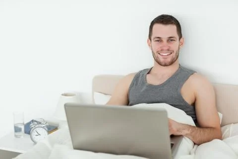 Young man using a notebook Stock Photos