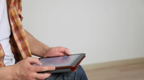 Young man using a pad Stock Footage 60064223