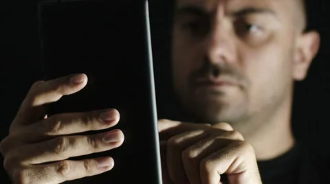 Young man is using phablet searching something on the web Stock-Footage 42431467