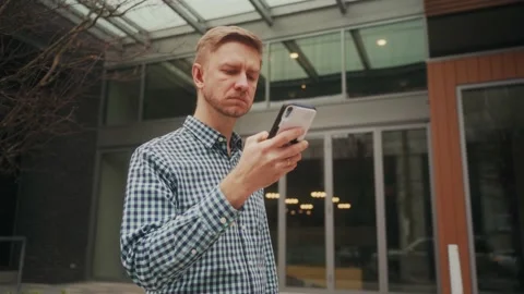 Young man using phone and walking to the work in Portland, USA, motivation Video stock 238762761