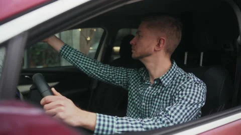 Young man using phone and going to the work by car vehicle in Portland, USA Stock Footage 239757582