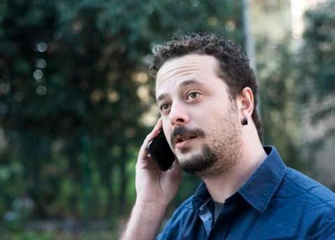 Young Man Using Phone Stock Photos