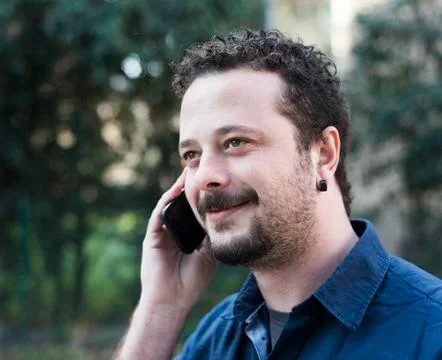 Young Man Using Phone Stock Photos