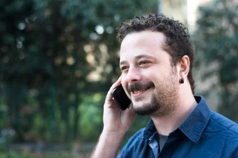 Young Man Using Phone Stock Photos