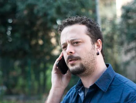 Young Man Using Phone Stock Photos