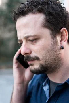 Young Man Using Phone Stock Photos