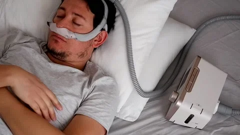 Young man using respirator machine for breathing. Stock Footage 132878786