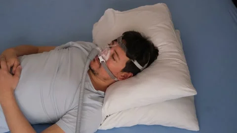 Young man using respirator machine for breathing. Stock Footage 132879116