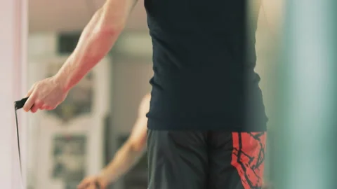 Young Man Using Skipping Rope Seen From the Back Stock Footage 123019279