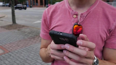 Young man using a smart phone Видео 76506854