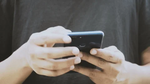 Young man using the smart phone- stay connected Stock Footage 129322120