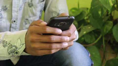 Young Man using smart phone Stock Footage 146658803
