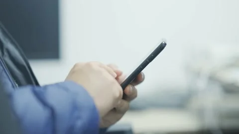 Young man using smart phone Stock Footage 194520762