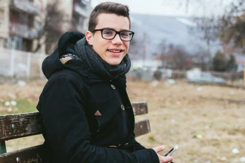 Young man using smart phone outdoors Stock Photos