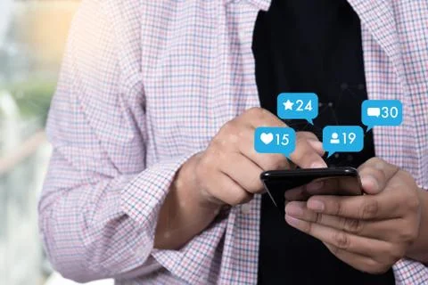 Young man using smart phone Social media and social network Marketing  concep Stock-Fotos