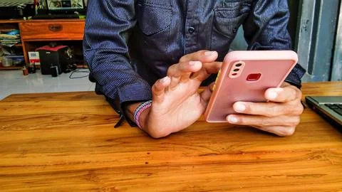 Young man using smart phone for business Stock Photos