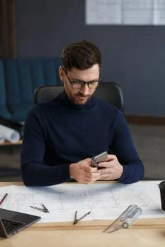 Young man using smartphone and smiling. Happy businessman using mobile phone Stock Photos