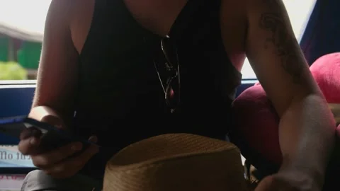 Young man using smartphone during Sangteo ride. Travel concept on vacation Stock Footage 196785720