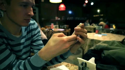 Young man using smartphone Stock Footage 48338539