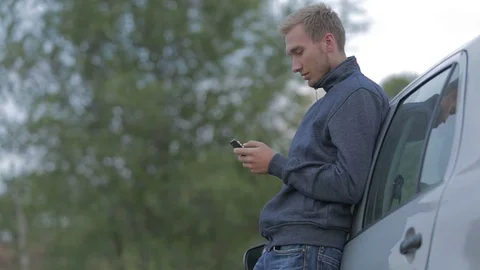 Young man using a smartphone Stock-Footage 71572661