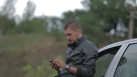 Young man using a smartphone Stock-Footage 71574960