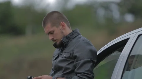 Young man using a smartphone Stock-Footage 71575382