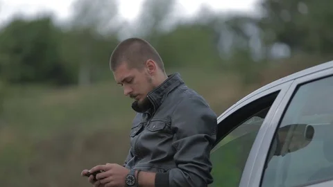 Young man using a smartphone Stock-Footage 71576173