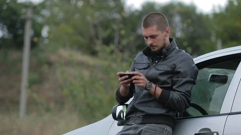 Young man using a smartphone Stock-Footage 71579954