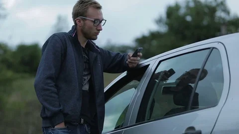 Young man using a smartphone Stock-Footage 71589722