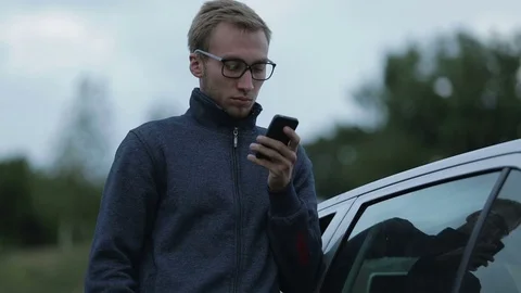 Young man using a smartphone Stock-Footage 71592287