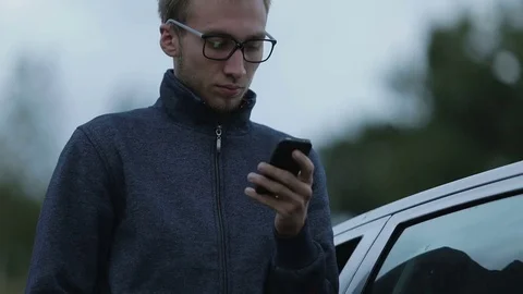 Young man using a smartphone Stock Footage 71595388