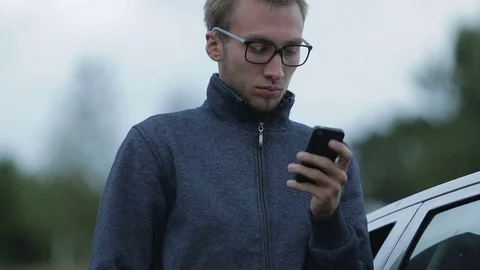Young man using a smartphone Stock-Footage 71597468