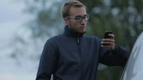 Young man using a smartphone Stock-Footage 71602174
