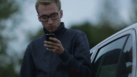 Young man using a smartphone Stock-Footage 71602888