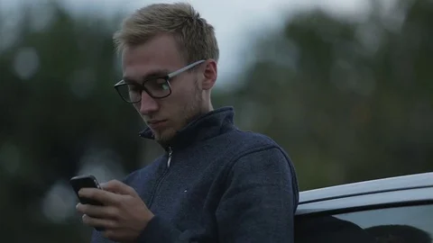 Young man using a smartphone Stock-Footage 71603269