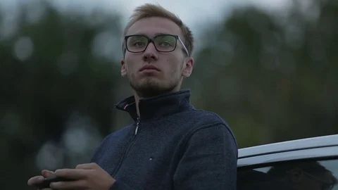 Young man using a smartphone Stock-Footage 71603785